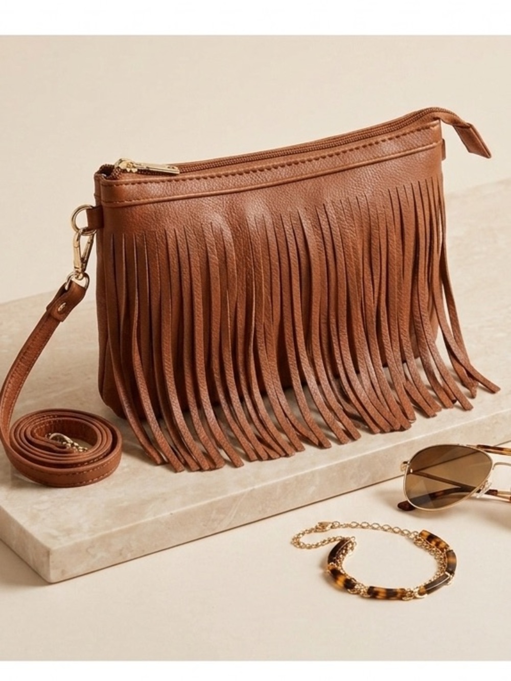 Misty Vegan Leather Crossbody Bag with Fringe Details.  Color cognac. 9X6